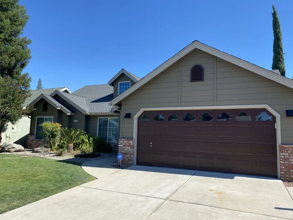 Single-family home in Clovis, CA with a freshly painted exterior and trim